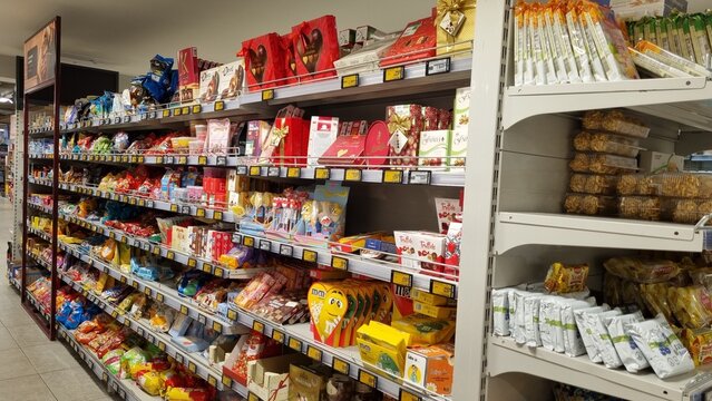Supermarket Candy and Chocolate Shelf with Assorted Confectionery Products