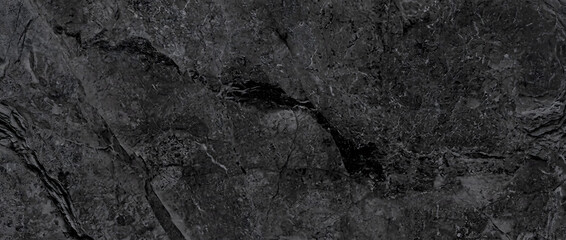 Marble background reveals a dark rustic black stone surface with detailed natural charcoal mineral veins © UmmeFarhatunnesa