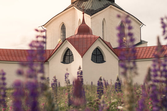 Pilgrimage Church of Saint John of Nepomuk on Zelen&aacute; Hora, Zdar nad Sazavou in Spring with Blooming Meadow