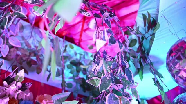 The vibrant floral setup represents traditional Indian wedding celebrations, marriage ceremonies, reception events, cultural festivities, event planning, luxury decoration, and romantic occasions.