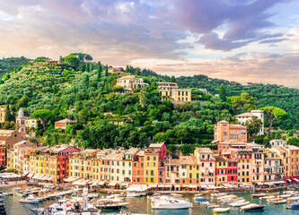 Fototapeta premium beautiful landscape of luxury resort Portofino in Luguria , Italy. Sea coast of elite italian resort during sunset or sunrise. Beautiful bay with buildings and green mountain forest.