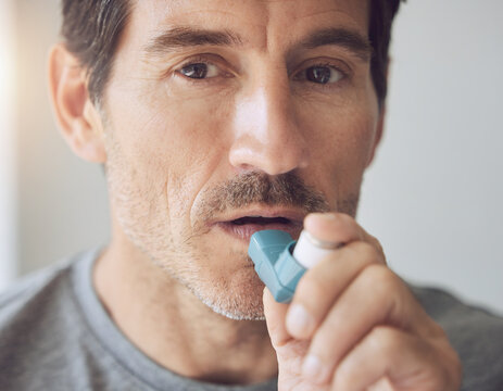 An adult male patient demonstrating compliance with a prescribed daily respiratory management routine during a clinical observational study session