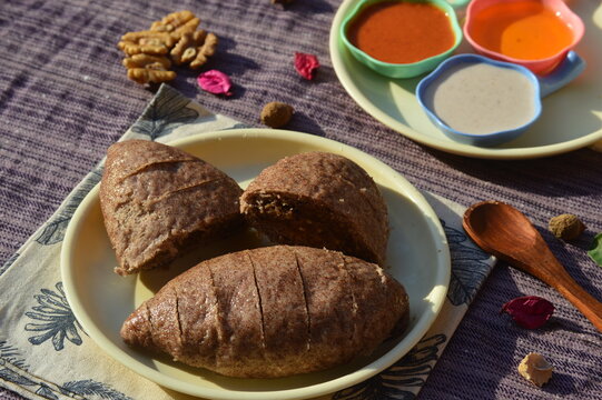 Millatret sidduor sidu a traditional Himachali dish,gluten-free rich in vitamins,mineral and essential amino acids.It is a fermented steamed bread made using finger millate flour stuffed with walnut, 