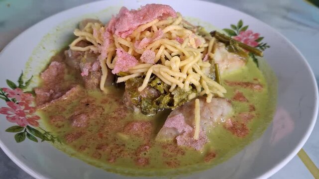 Lontong sayur pakis traditional food from Indonesia using Fiddleheads fern vegetables
