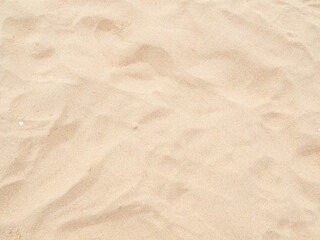 Obraz premium Sand nature travel background, beach close up texture summer desert zen garden coast ocean for vacation, hot tropical scene nature, holiday dune pile dry brown heap