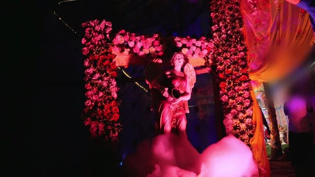 Beautiful wedding decoration featuring colorful artificial and fresh flowers, marigold garlands, floral arches, decorative lights, wedding backdrop elements, and festive stage arrangements.