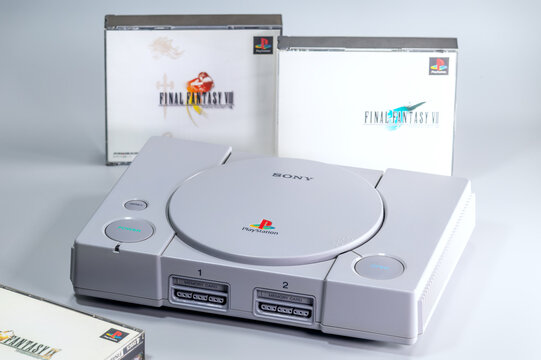 Fukuoka, Japan. June 6, 2026: Original Sony PlayStation console displayed with Final Fantasy VII and Final Fantasy VIII game cases in a retro gaming product photograph.