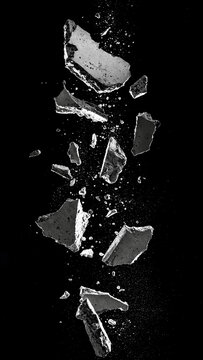 Exploding Concrete Chunks with Falling Debris, Vertical Shattered Stone on Black Background