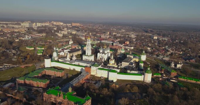 Cinematic aerial orbit shot of the Trinity Lavra of St. Sergius monastery and cityscape in Sergiev Posad