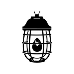 Obraz premium A striking black silhouette of an industrial cage lamp with a flame inside a dramatic silhouette