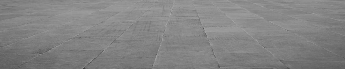 Obraz premium empty stone floor top in perspective. grey tile floor background in perspective view. line. empty copy space stone street. pavement. Granite outdoor tiled floor. gray granite. Marble texture
