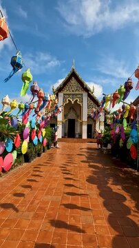 Wat Phra That Chang Kham Worawihan .The temple is located in the heart of Nan Thailand . Inside the chapel, the atmosphere is quiet and magical : Dolly in Footage