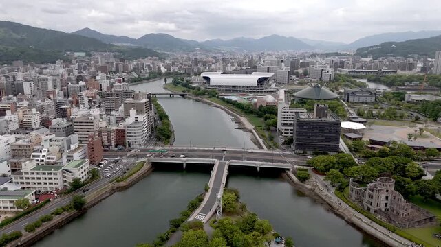 Aerial View of Urban Hiroshima Cityscape with Kyu Ota River and Mountains in Background Japan
