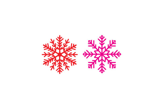 Two snowflakes in red and pink colors set against pristine white background, representing winter, cold, holidays, and festive season.