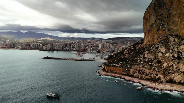 Aerial drone view of Penon de Ifach rock and Calpe marina, Spain