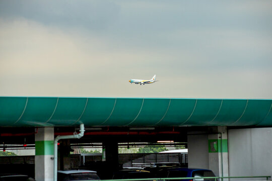 Nok Air the plane is preparing to landing at Don Mueang International Airport (DMK) in the evening