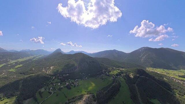 scenic  aerial footage pilot POV of french alps in Provence under blue sly and nice white clouds 