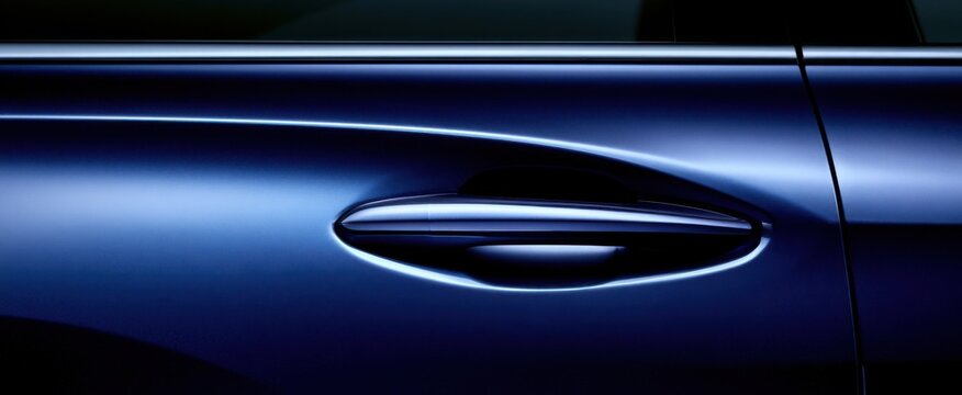 Close-up of blue hybrid car featuring recessed door handle, contemporary design details, smooth curves, shiny navy finish, advanced technology, elegant exterior, streamlined vehicle appearance