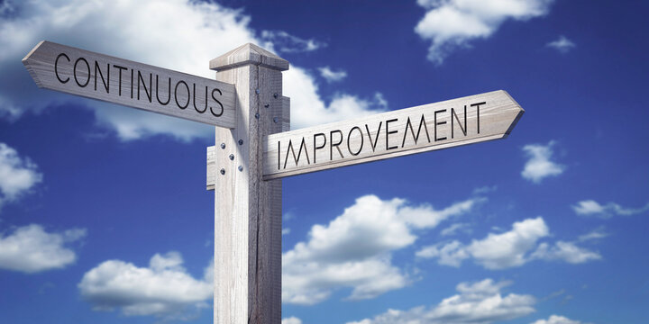Continuous Improvement - Wooden Signpost with Two Arrows