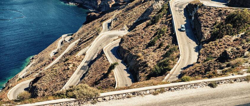 Winding island road, seascape and mountains