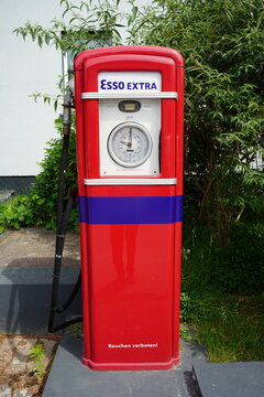 Unna&ndash;North Rhine-Westphalia, Germany, June 6, 2026. Vintage Esso gas pump from the 1950s or 1960s. It is in original condition, featuring a red paint finish, a blue stripe, and an analog display.