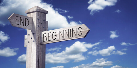 Obraz premium End and Beginning - Wooden Signpost with Two Arrows
