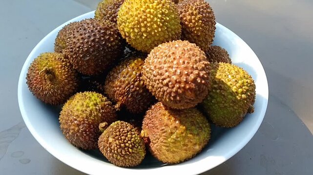 Fresh honey lychee fruits on a clean white background for product copy space