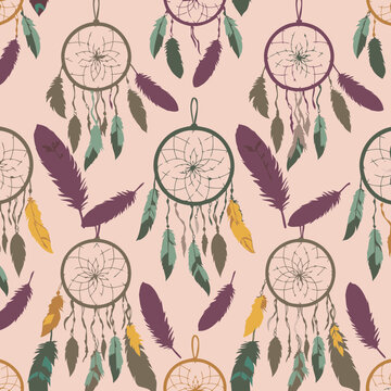 Dreamcatcher pattern with various colored feathers in a repeating design. Decorative dreamcatchers with colorful feathers hang on a pastel-colored background.