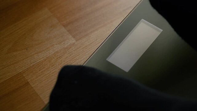Stepping on scales for weight measurement video