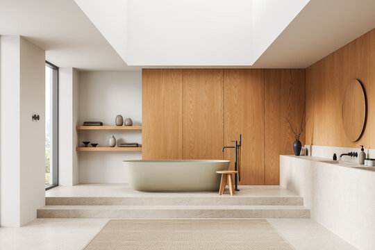 Serene modern bathroom interior with freestanding tub, warm wood panels, soft natural light, minimalist decor and spacious layout captured in calm style. 3D Rendering