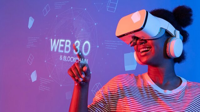 Woman Using Virtual Reality Headset with Excitement in a Futuristic Environment Featuring Web 3.0 and Blockchain Technology Graphics. Entropy.