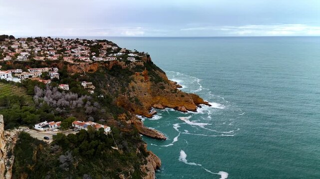 Aerial view of Cap de la Nau cliffs and coastal villas, Spain