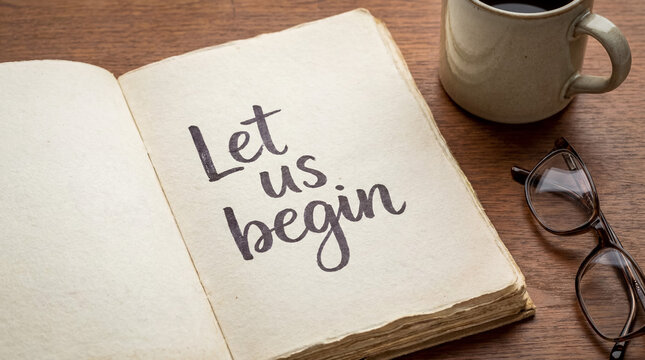 Old open book showing let us begin message on a rustic wooden desk with a mug of coffee and reading glasses
