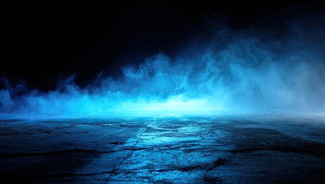Ethereal blue mist drifts across a wet, reflective concrete surface