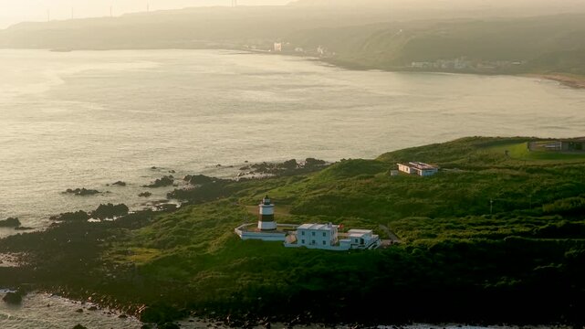 Aerial view of coastal lighthouse on rocky shore in Taiwan 