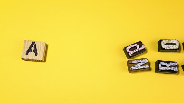 Andropause Concept Shown With Vintage Letterpress Blocks on Yellow Background