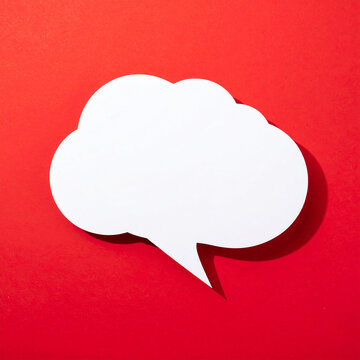 Blank notification message pop-up in speech cloud shape, vivid red background, modern UI design, mockup, minimal composition. Close-up.