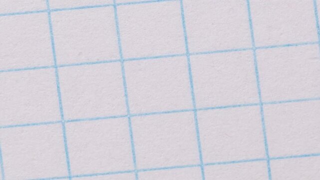 Timelapse of a sheet of checkered paper close-up, page turning, paper texture and background