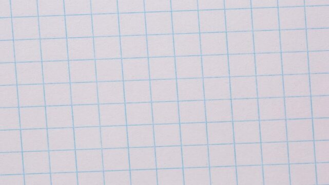 Timelapse of a sheet of grid paper close up, page turning