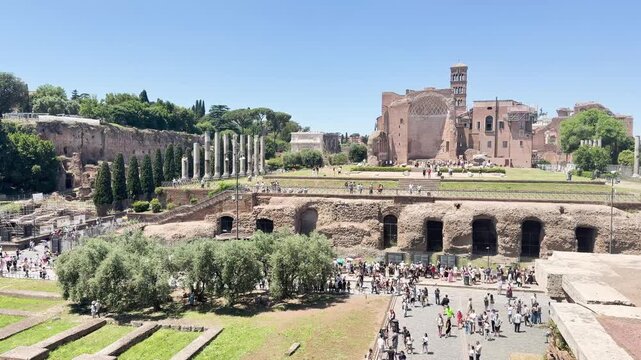 Panoramic view of Roman Forum ruins with temples and triumphal arch