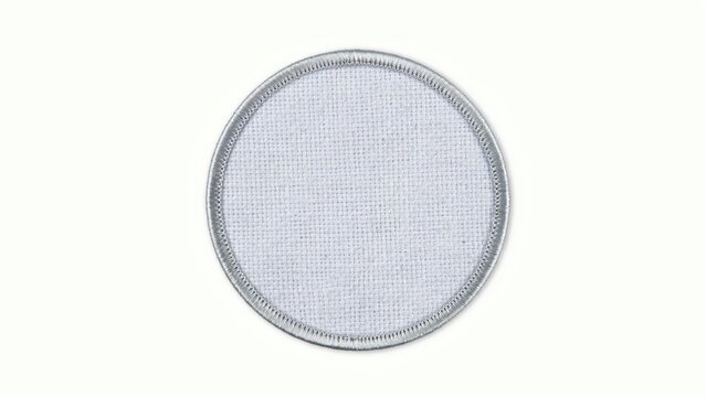 Blank circular fabric patch with silver border isolated on white background