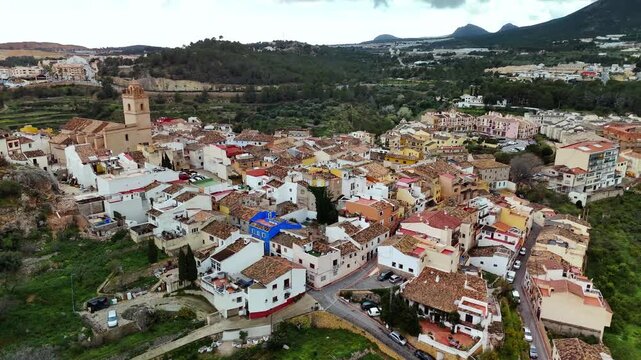 Aerial drone view circling historic old town and houses, Polop, Spain