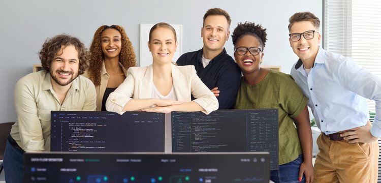 Developers team programmers startup office coding collaboration. Friendly people group behind computer monitors with code, showing agile methods and software skills. Clear idea of team work.