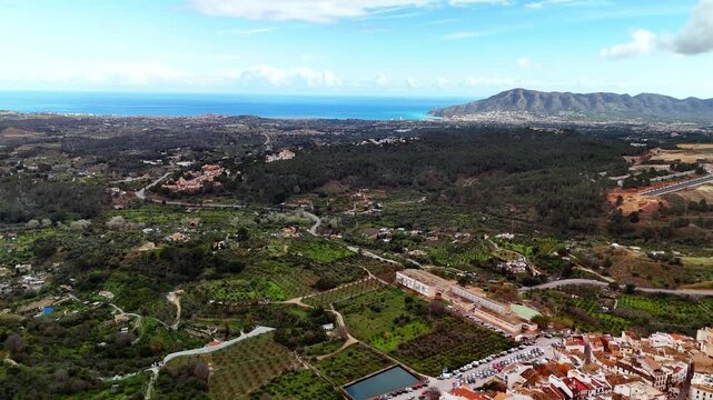 Aerial drone view of Polop town and green countryside, Costa Blanca, Spain