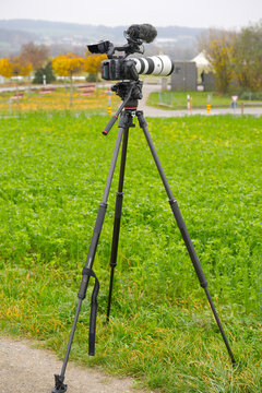 Sony FX-6 video camera on Manfrotto tripod with Deity microphone airplane spotter equipment at village of Oberglatt on an autumn day. Photo taken November 10th, 2025, Zurich Oberglatt, Switzerland.