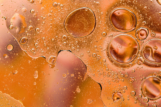 Warm amber oil bubble abstract texture photography