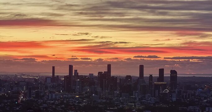 4K locked off stationary sunrise with cloud cover Time Lapse view of Brisbane CBD view from the observation point of Mount Coot-tha, Brisbane, Queensland, Australia
