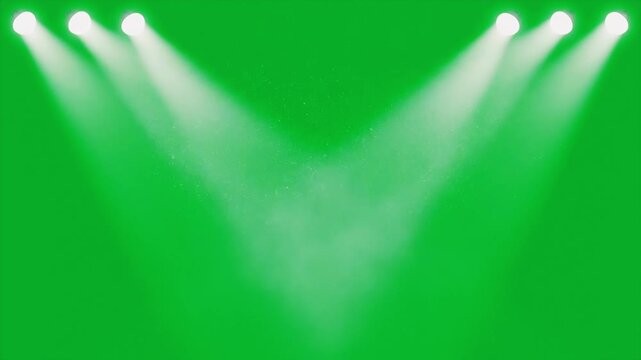 Dynamic stage lighting illuminates a vibrant green screen backdrop, creating an ideal setting for special effects and theatrical productions