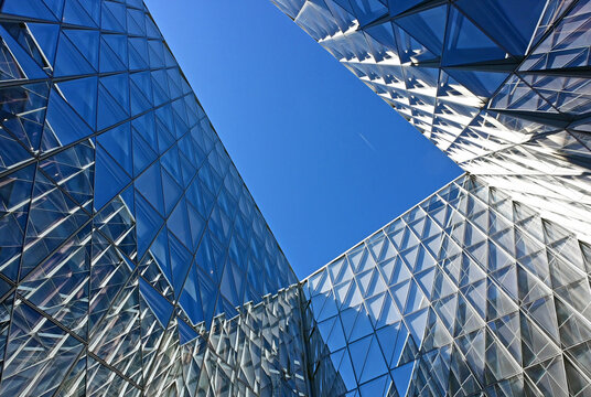 Geneva, Switzerland, Europe :  05.2026 :  Japan International Tobacco (JIT) - futuristic headquarters building with characteristic innovative self-shading glass facade