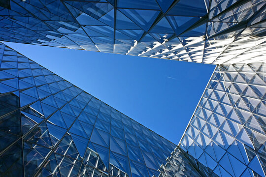 Geneva, Switzerland, Europe :  05.2026 :  Japan International Tobacco (JIT) - futuristic headquarters building with characteristic innovative self-shading glass facade